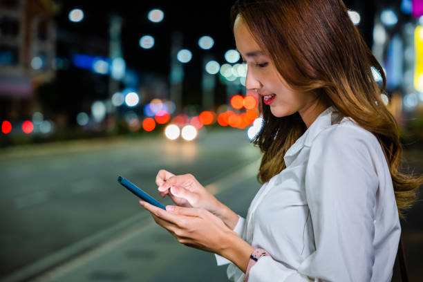 istock Close up of young woman using mobile app device on smartphone 1907003325