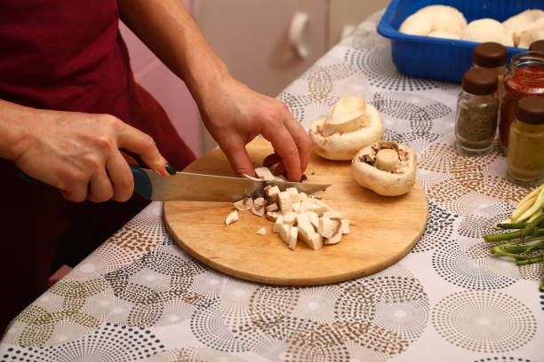 istock Mushrooms on wooden cutting board 1907007235