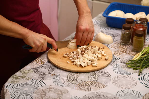 istock Mushrooms on wooden cutting board 1907010017