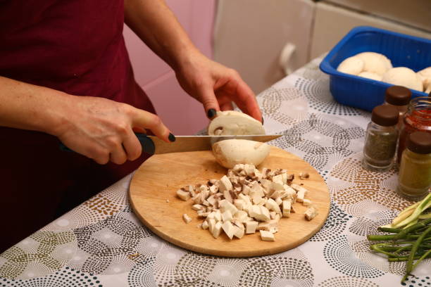 istock Mushrooms on wooden cutting board 1907012114