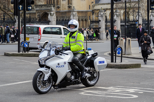 Westminster, London, UK - February 4th 2015: Metropolitan Police motorcycle from the Special Escort Group (SEG) stopped near the Houses of Parliament.