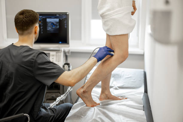 istock Ultrasound specialist scans veins on a woman's leg 1907055701