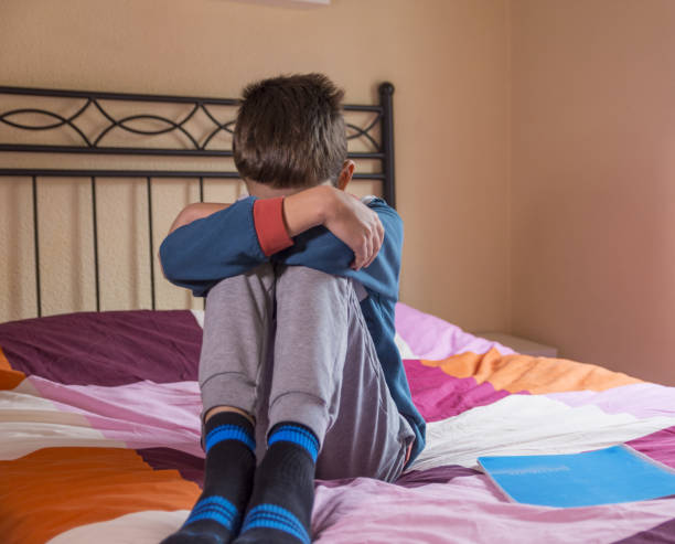 istock A boy dealing with depression, sadness, and feeling alone. Mental health and anxiety. Asking for help. Therapy and rehabilitation. Troubled teenager. 1907081943