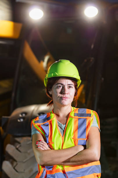 istock Hispanic woman working at construction site at night 1907136583