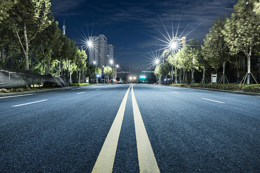 Modern city empty asphalt road and buildings background