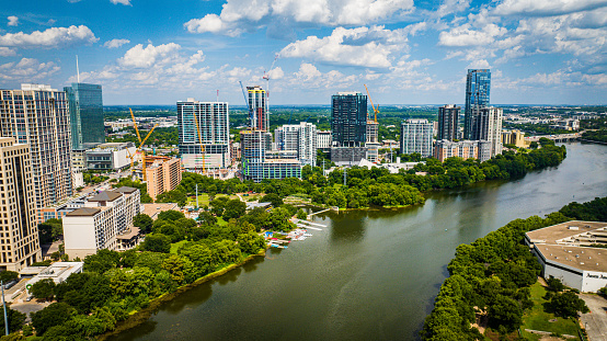 Austin, United States – June 10, 2023: An aerial view of downtown Austin with modern buildings along the riverbank. Texas, USA