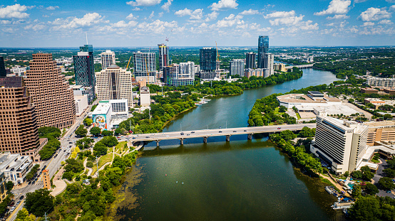 Austin, United States – June 10, 2023: An aerial view of downtown Austin with modern buildings along the riverbank. Texas, USA