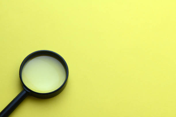 istock magnifying glass magnifier loupe search symbol on yellow background with copy space 1907182063