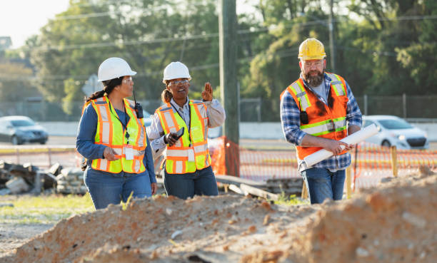 istock Diverse team of three construction workers at job site 1907187987