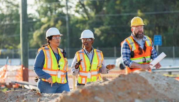 istock Diverse team of three construction workers at job site 1907187990