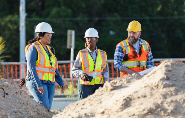 istock Diverse team of three construction workers at job site 1907187992