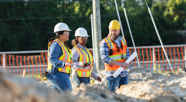 istock Diverse team of three construction workers at job site 1907188005