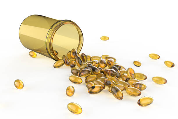 istock Fish oil capsules with omega 3 and vitamin D. 1907203301