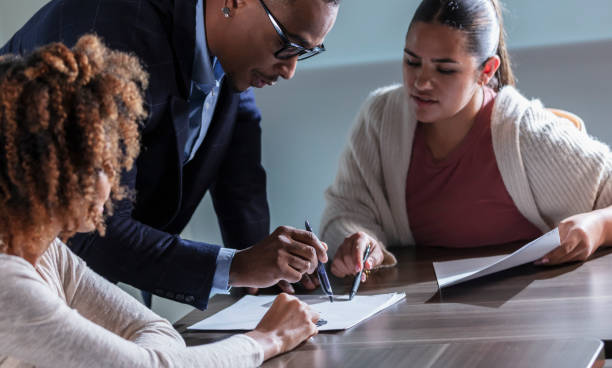 istock Multiracial business people in meeting reading papers 1907226812