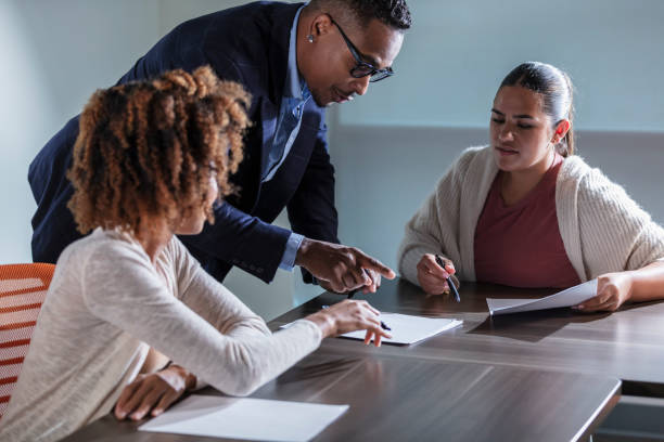 istock Multiracial business people in meeting reading papers 1907226822