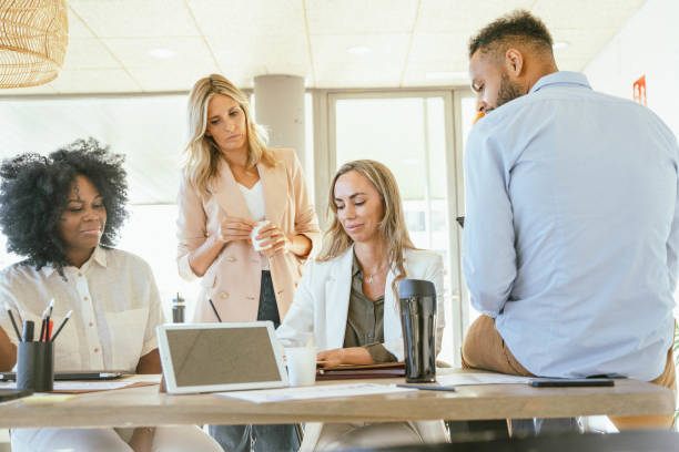 istock Business team sharing ideas for a startup project while working together in the office. 1907234481