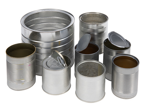 A selection of empty recyclable steel food cans on white background with a clipping path