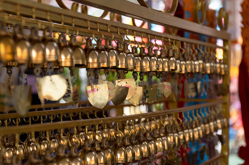 Small bell for pray decorate in Thai Buddha temple. Select focus shallow depth of field.
