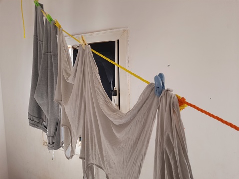 Clothes that have been washed and hung on a line to dry
