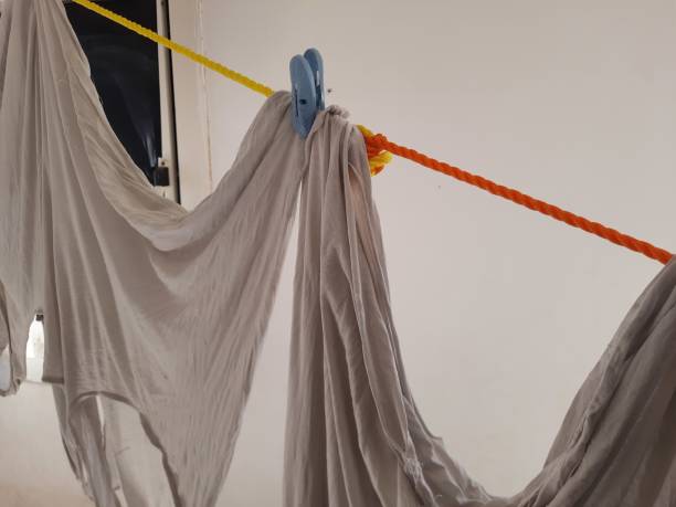 istock Clothes that have been washed and hung on a line to dry 1907307513