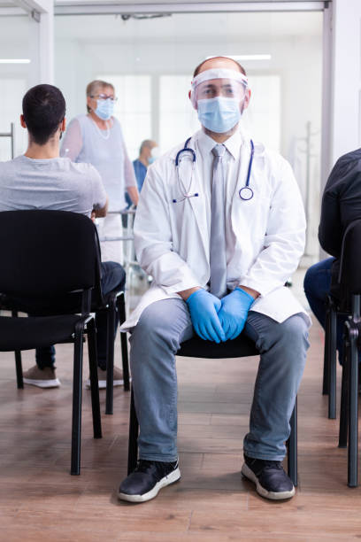 istock Exhausted doctor in hospital waiting room 1907325048