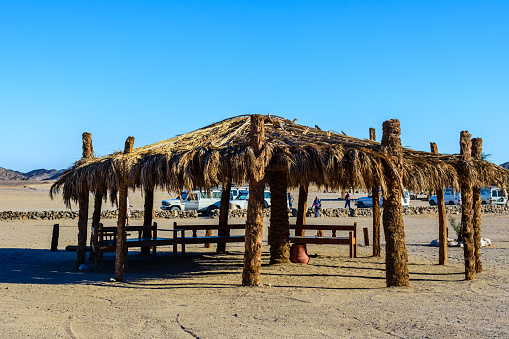 Hurghada, Egypt - December 10, 2018: Bedouin building of palm twigs in arabian desert not far from Hurghada city, Egypt