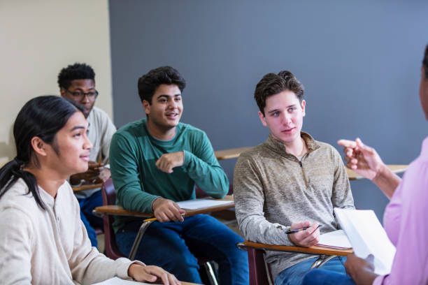 istock Four multiracial teenage boys taking high school class 1907342584