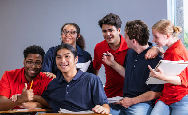 istock Group of multiracial high school students in classroom 1907343133