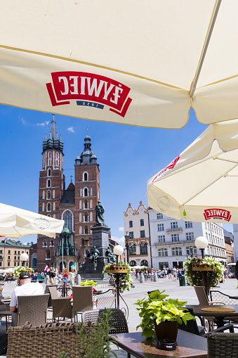 Krakow, Poland - July 18, 2023: Cityscape with main square Rynek Glowny and St. Mary's Basilica of Krakow Malopolska region in Poland