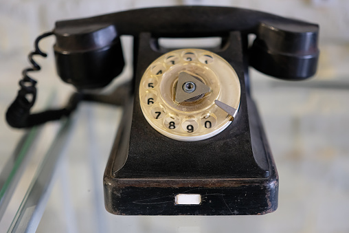 Old classic black telephone. Rotary Dial.