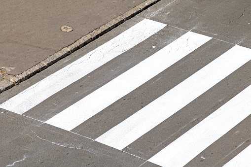 Zebra crossing traffic sign outside on asphalt in an urban city street
