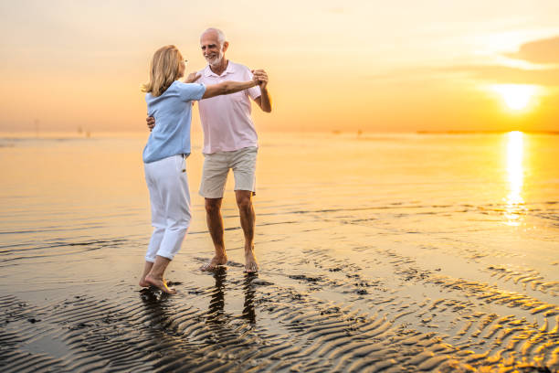 istock Senior couple enjoying on beach 1907376907