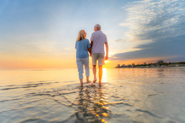Senior couple walking on beach