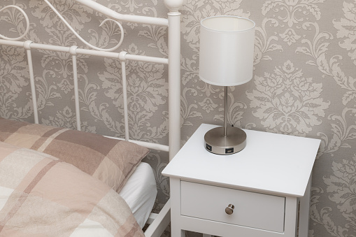 Bedside table with a lamp