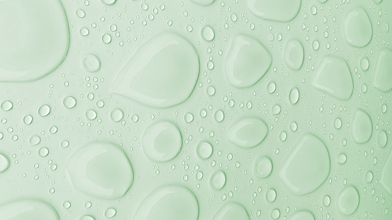 Green background with transparent drops with effects