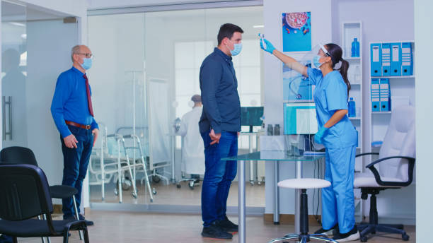 istock Nurse with visor against covid19 1907393577