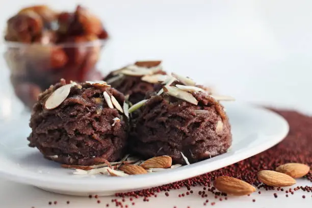 Ragi dates Sheera. Indian pudding made of finger millet flour ghee, milk, dates and dry fruits. Traditionally known as ragi halwa. Classic Indian sweet, usually made with semolina, replaced with Ragi