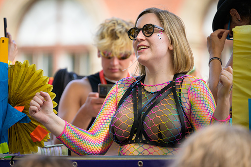 Vienna, Austria - June 17, 2023: People at Vienna Pride in summer on Wiener Ringstrasse, woman with glasses