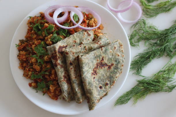 istock Dil Paratha served with scrambles cottage cheese and garnished with coriander leaves. 1907441935