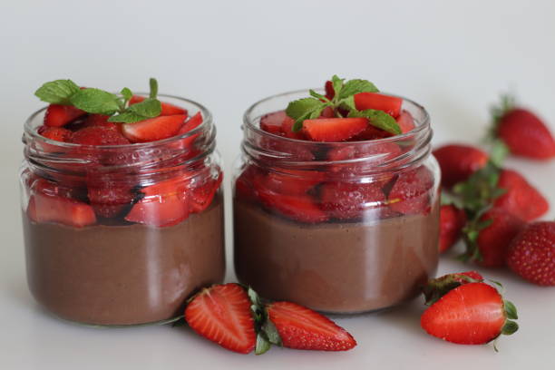 istock Chocolate strawberry custard. Chocolate custard served with fresh chopped strawberries. A quick and easy dessert 1907446545