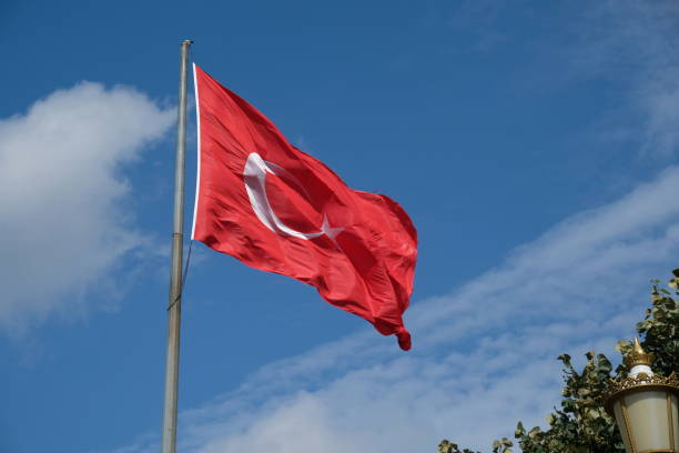 istock Turkish flag flutters in the wind close-up 1907458849