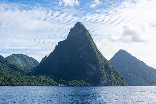 A photo of the Twin Pitons in St Lucia on a sunny day as seen from the Caribbean Sea.