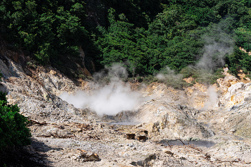 Steam rising from the Sulphur Springs mud baths created from a collapsed volcano in Soufriere, Saint Lucia
