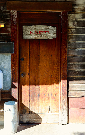 Rustic wood door to a vintage cabin