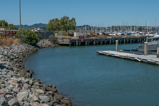 Sausalito, California, USA- August 12, 2023: Boats and yachts docked in cove in Sausalito, California at a beautiful sunny day