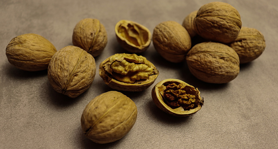 Food wallpaper. Walnuts on old table background for banner concept