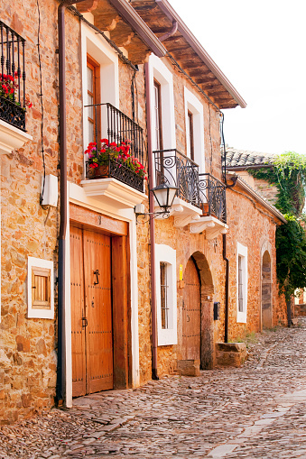 Traditional ancient village street wooden doors, stone houses.  Castrillo de los Polvazares, León, Castilla y León, Spain.