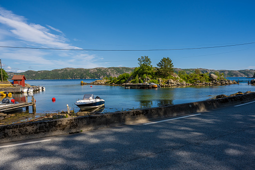Lyngdal, Norway - July 06 2023: Small harbour at Lundegaard in summer.