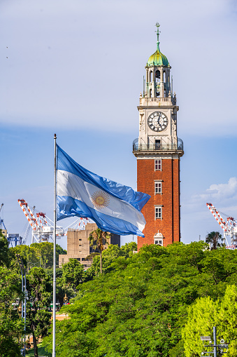 A picture of the Torre Monumental of Buenos Aires and the Argentina flag