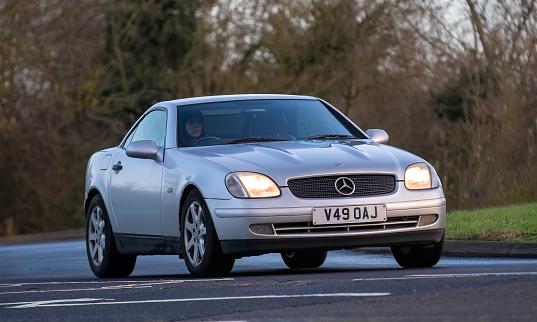 Stony Stratford,UK Jan 1st 2024. 1999 silver Mercedes Benz SLK car arriving at Stony Stratford for the annual New Years Day vintage and classic vehicle festival.